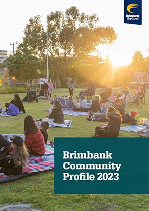 Cover of the Brimbank Community Profile 2023 with photo of community on the grass at a park while sunsets.