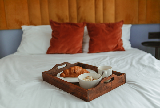 Breakfast tray on hotel bed