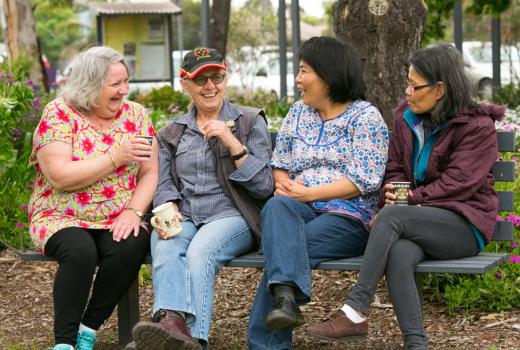 Brimbank residents laughing together on a park bench