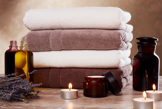 Folded towels and beauty products