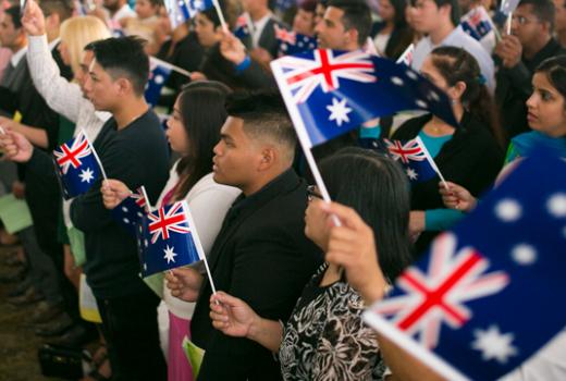 Crowd holding Australia flags 
