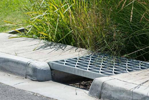 Stormwater drain and gutter on suburban street
