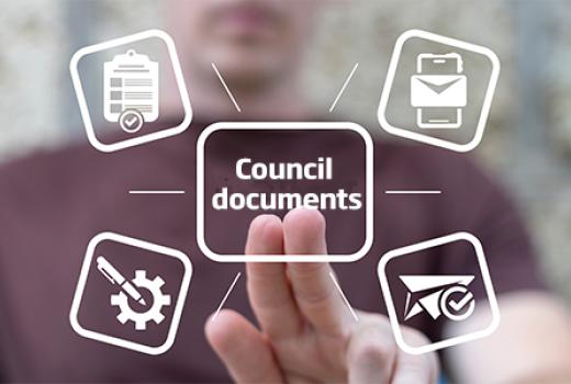 Man pressing two fingers on virtual screen for Council documents